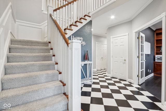 staircase with ornamental molding