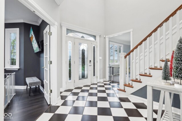 5784 N 600 E, Greenfield, IN 46140 - foyer entrance with tile patterned floors, baseboards, stairway, and a towering ceiling