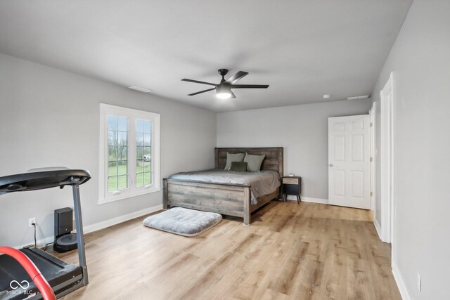 5784 N 600 E, Greenfield, IN 46140 - bedroom featuring light wood-style flooring, baseboards, and ceiling fan