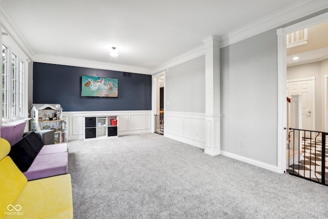 5784 N 600 E, Greenfield, IN 46140 - unfurnished living room featuring carpet flooring, ornamental molding, a wainscoted wall, and a decorative wall