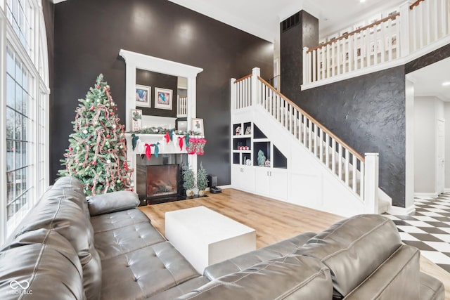 5784 N 600 E, Greenfield, IN 46140 - living room featuring baseboards, a fireplace, and stairs