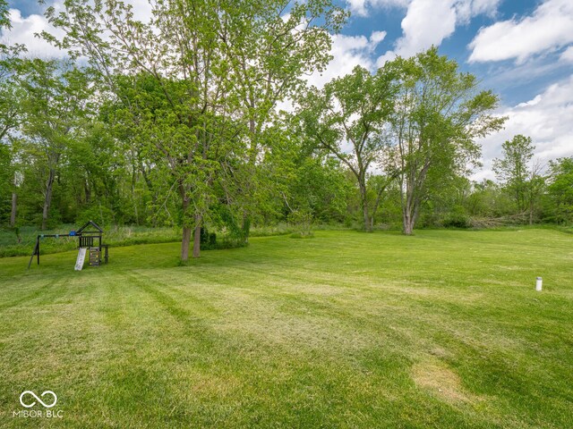 5784 N 600 E, Greenfield, IN 46140 - view of green lawn featuring a playground
