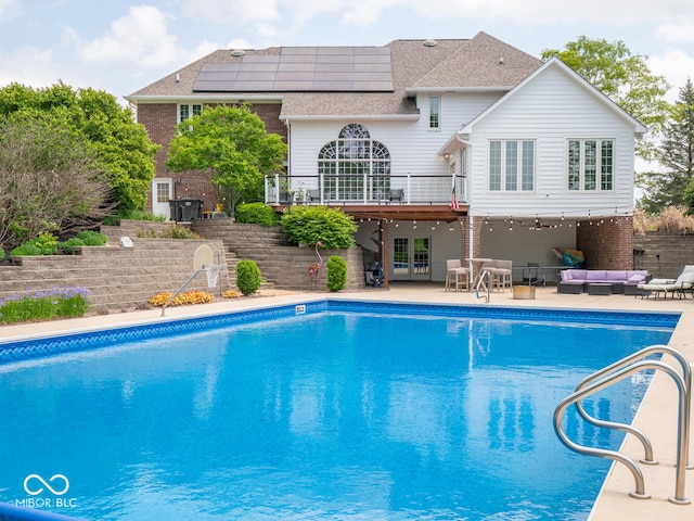 5784 N 600 E, Greenfield, IN 46140 - view of pool with an outdoor hangout area, a wooden deck, a patio area, and french doors