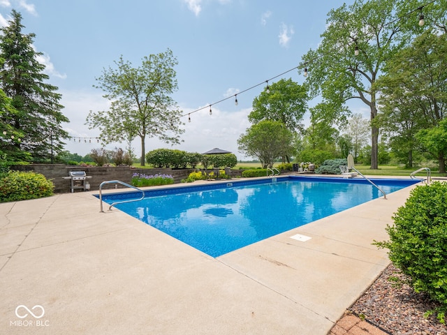 5784 N 600 E, Greenfield, IN 46140 - view of swimming pool with a patio area and area for grilling