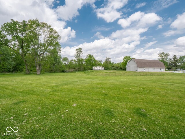 5784 N 600 E, Greenfield, IN 46140 - view of grassy yard featuring a barn and an outdoor structure