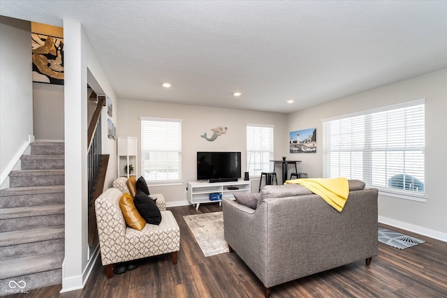 7282 Zanesville Rd, Carmel, IN 46033 - living area with dark wood-style flooring, stairs, baseboards, and recessed lighting