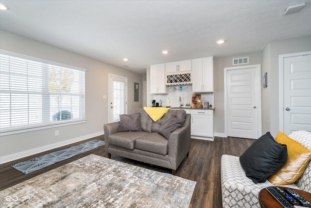 7282 Zanesville Rd, Carmel, IN 46033 - living room with a dry bar, recessed lighting, baseboards, visible vents, and dark wood-style floors
