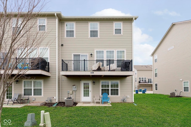 7282 Zanesville Rd, Carmel, IN 46033 - back of property with a balcony, a patio area, central AC, and a lawn
