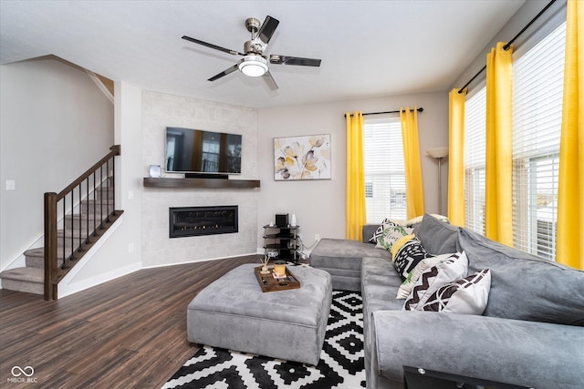 7282 Zanesville Rd, Carmel, IN 46033 - living room featuring baseboards, ceiling fan, stairs, wood finished floors, and a tile fireplace