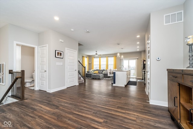 7282 Zanesville Rd, Carmel, IN 46033 - living room with baseboards, dark wood-style flooring, recessed lighting, and visible vents