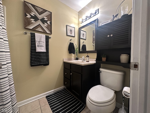 full bathroom featuring baseboards, vanity, toilet, and tile patterned floors