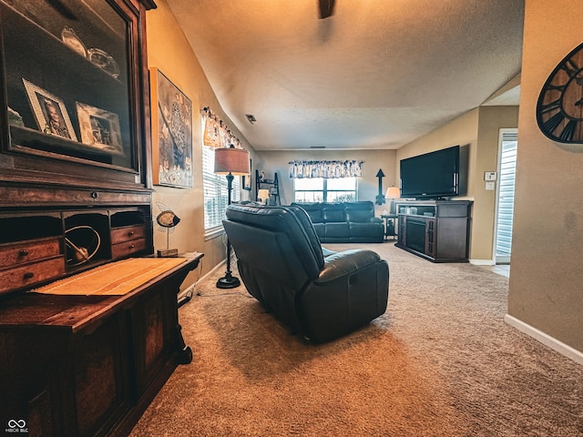 carpeted living room featuring visible vents, baseboards, vaulted ceiling, and a textured ceiling