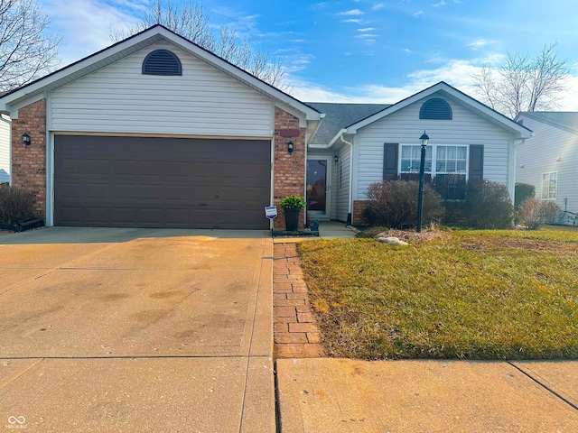 ranch-style home with a garage, driveway, brick siding, and a front lawn