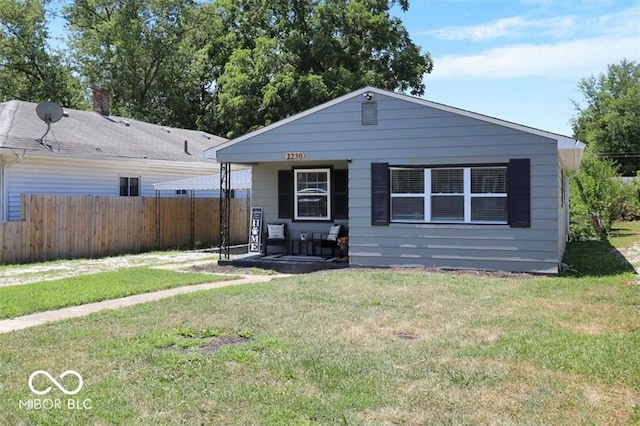 view of front of home with a front lawn and a porch