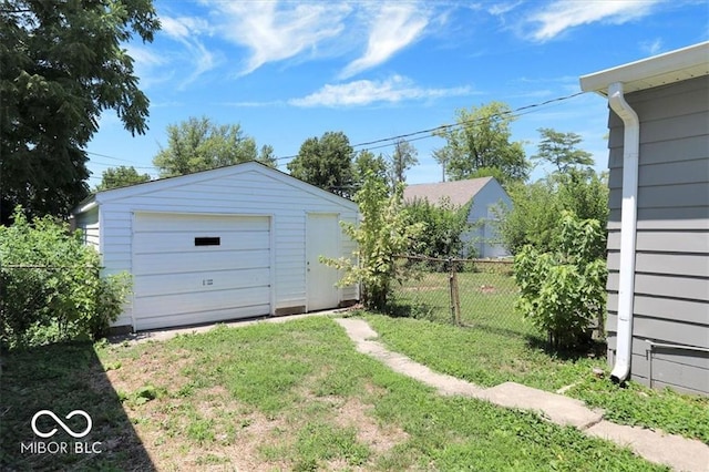 garage featuring a yard