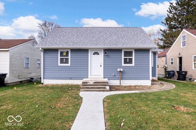 bungalow-style house with a front lawn