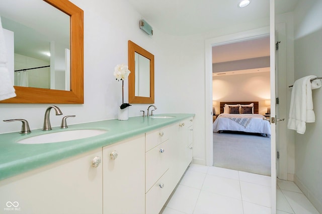 bathroom with tile patterned floors and vanity