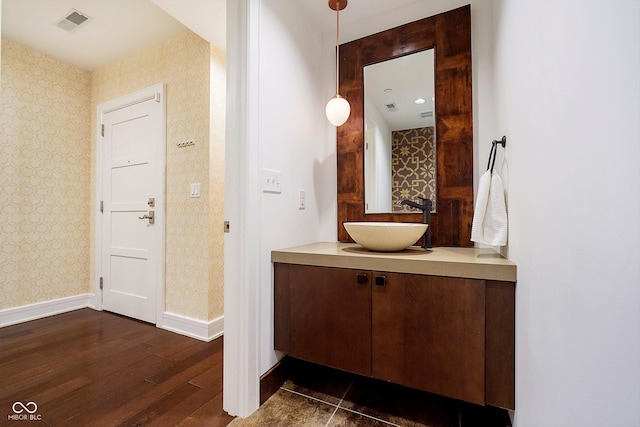 bathroom with hardwood / wood-style floors and vanity