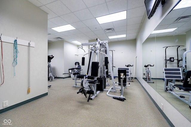 gym featuring a paneled ceiling