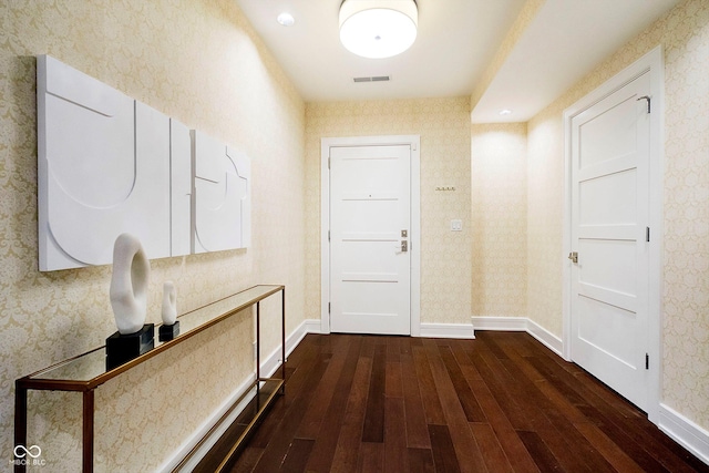 corridor featuring dark hardwood / wood-style floors