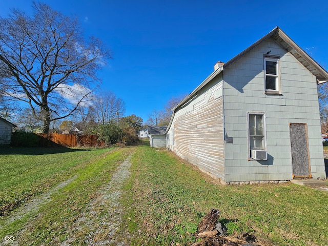 view of property exterior featuring a lawn