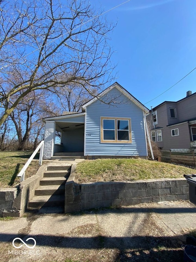 view of front of property featuring a carport