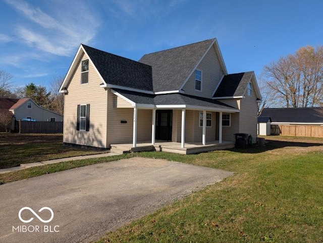 rear view of house featuring a lawn