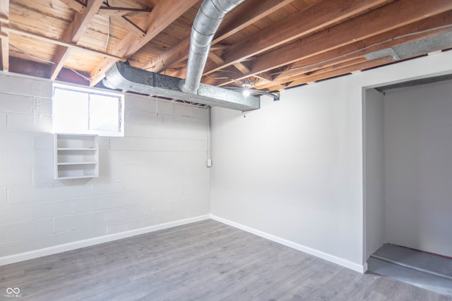 basement with wood-type flooring