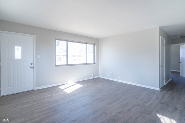 foyer with dark hardwood / wood-style flooring