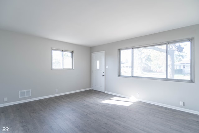 unfurnished room featuring dark hardwood / wood-style flooring