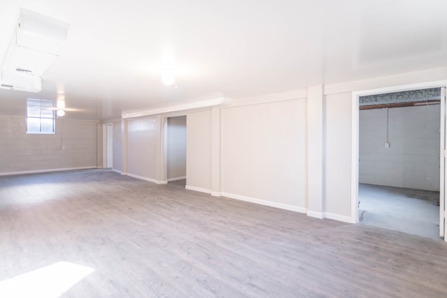 basement featuring hardwood / wood-style floors