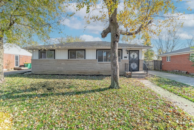 ranch-style house with a front yard