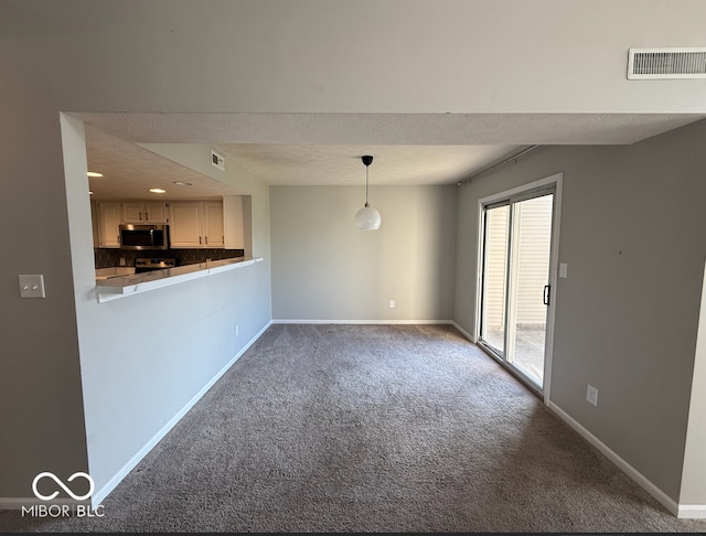 unfurnished living room with carpet flooring