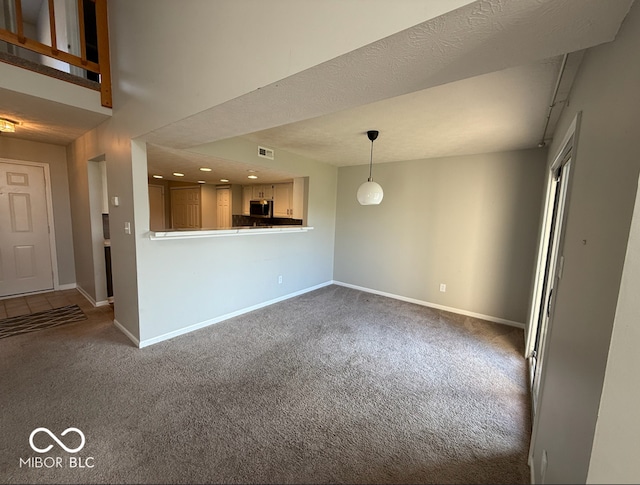 unfurnished living room with carpet floors