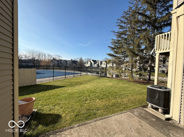 view of yard with central AC unit