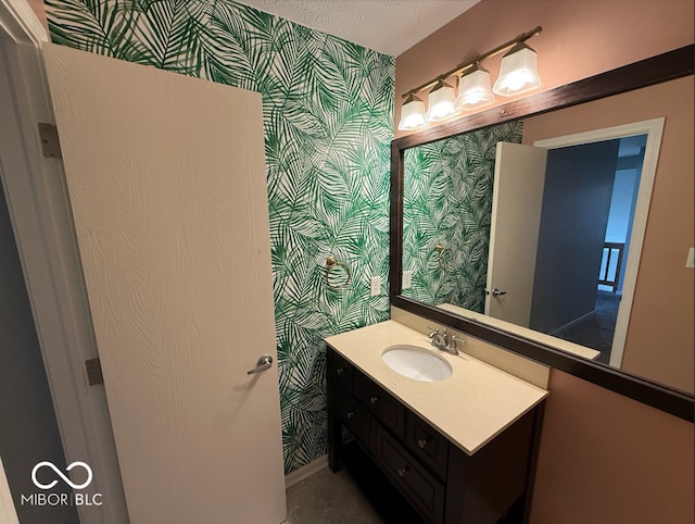 bathroom with vanity and a textured ceiling