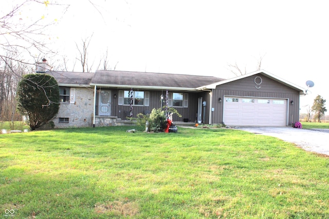 single story home with a front lawn and a garage