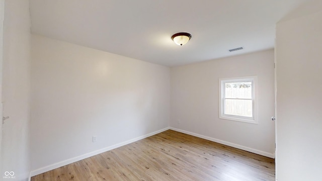 empty room with light hardwood / wood-style floors