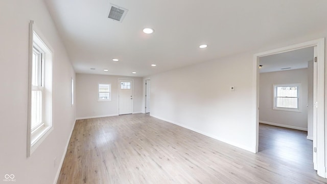 spare room featuring light hardwood / wood-style flooring