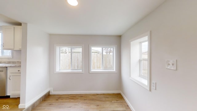 unfurnished dining area with light hardwood / wood-style flooring