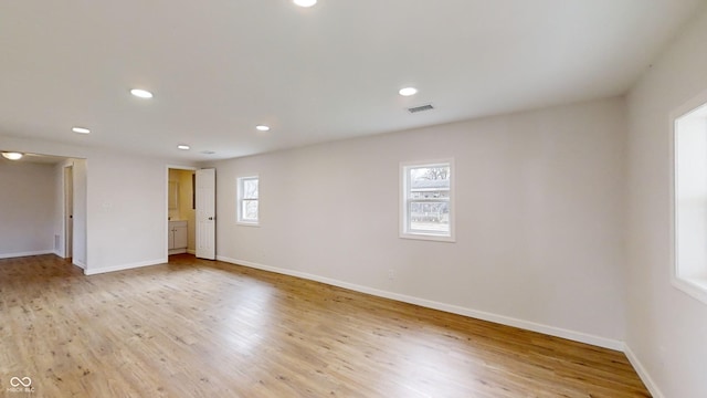 spare room with light wood-type flooring