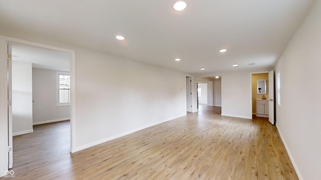 spare room with light wood-type flooring