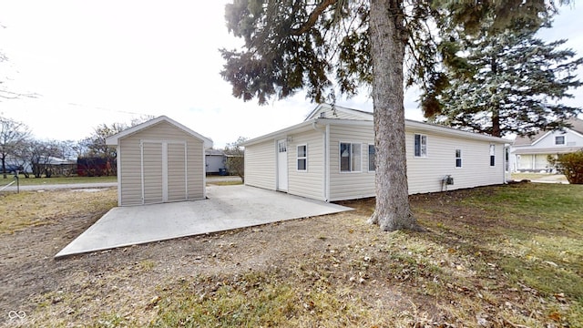 rear view of property featuring a patio