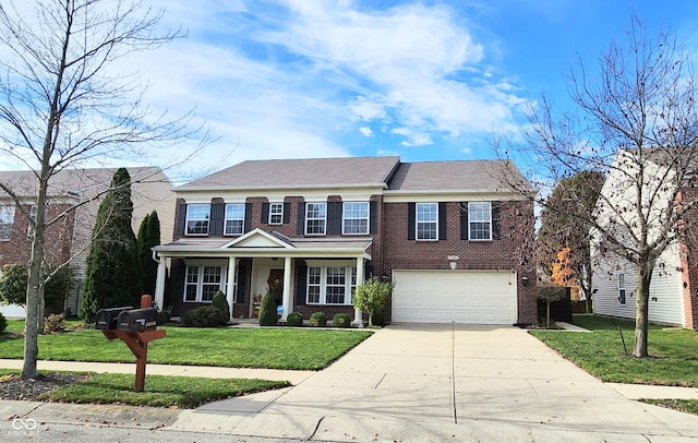 view of front facade featuring a garage and a front lawn