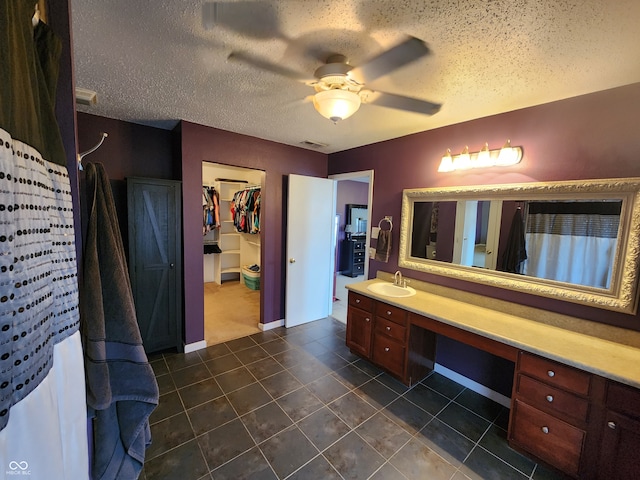 bathroom with vanity, a textured ceiling, tile patterned floors, and ceiling fan