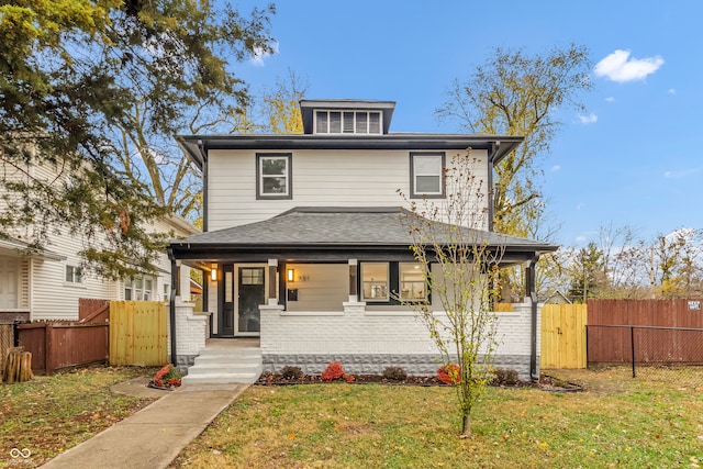 view of front facade with a porch and a front yard