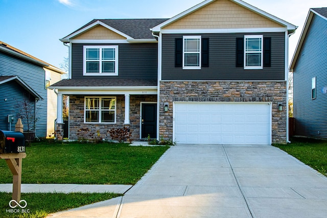 craftsman-style house with a garage and a front lawn