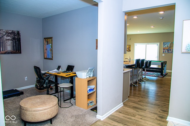 home office with hardwood / wood-style floors