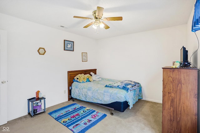 bedroom featuring ceiling fan and light colored carpet