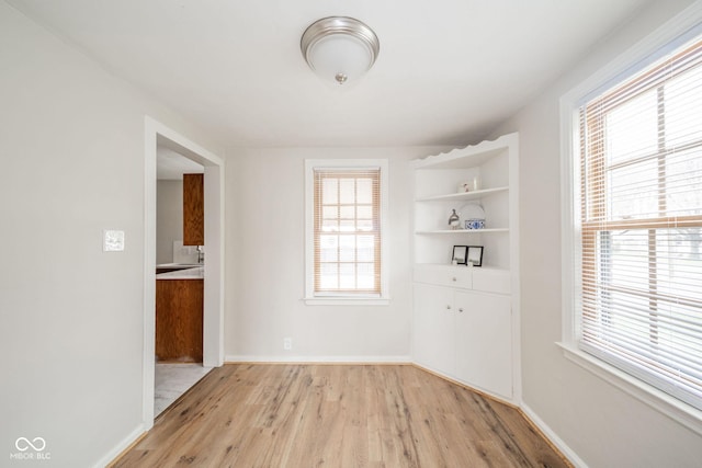 unfurnished room with light hardwood / wood-style floors